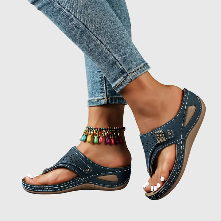 Trendy women's platform sandals with a distinctive cut-out thong strap. Perfect heeled summer slip-ons.
