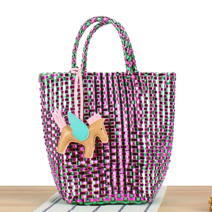Textured handwoven straw basket bag for women, a playful and charming summer handbag.