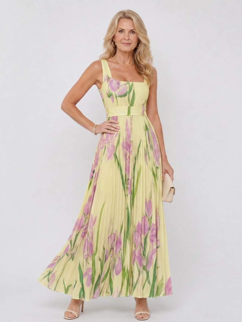 Women's sleeveless midi dress with a charming floral print, pleated detail, and square neckline.