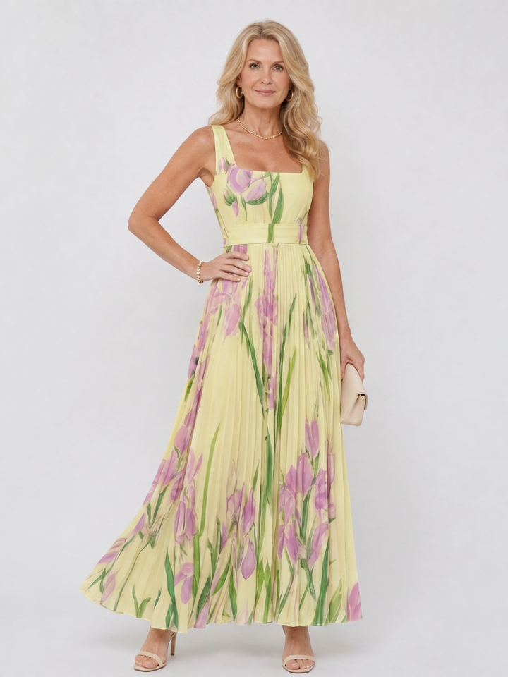 Women's sleeveless midi dress with a charming floral print, pleated detail, and square neckline.