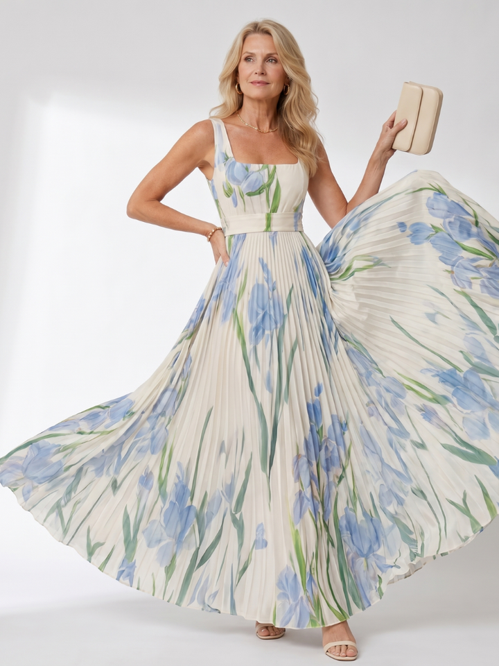 Chic women's vacation midi dress: sleeveless, pleated, and adorned with a delightful floral pattern.