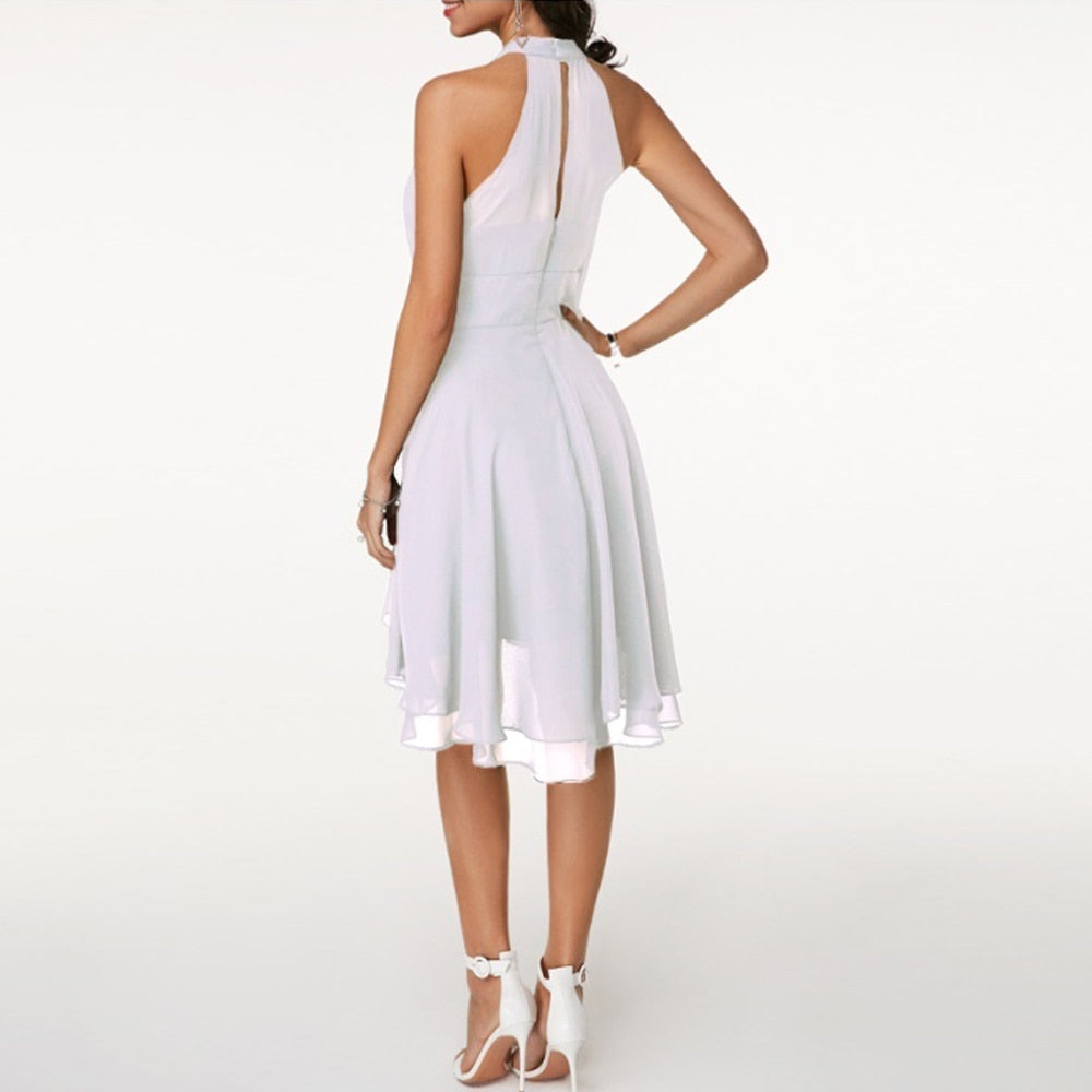 Women's evening dress: layered pleated mini dress with a flattering halter neck.