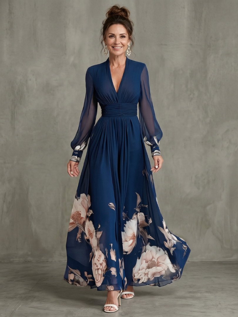Women's pleated navy maxi dress with sheer floral sleeves & V-neck, perfect for wedding guests or garden parties.