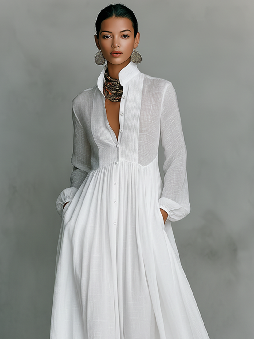 Women's flowing pleated pintuck maxi dress. Long sleeve, button front. Chic and versatile for everyday wear.