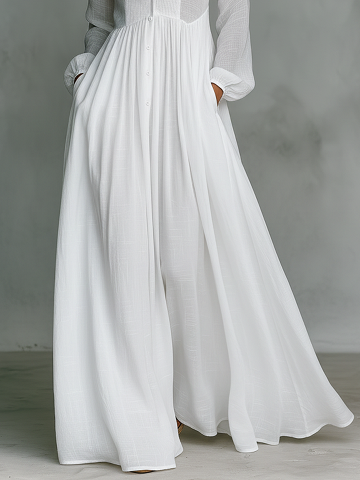 Stylish women's long sleeve pleated pintuck maxi dress. Features pintucks, pleats & button front. Elegant casual.