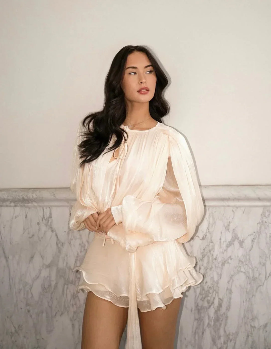 Women's pleated puff-sleeve mini dress with a flowy tie-waist, perfect for summer style.