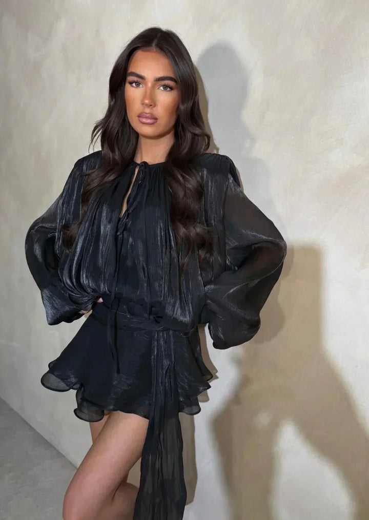 Chic women's mini dress, pleated with elegant puff sleeves & tie-waist, perfect for day or evening wear.