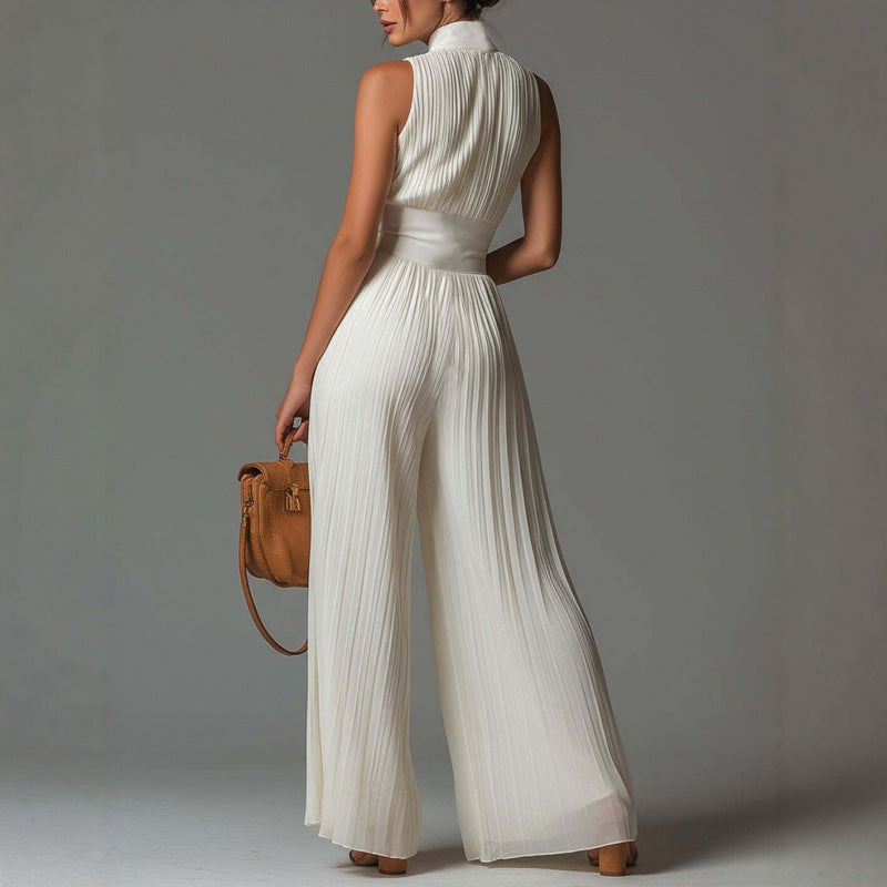 Women's mock neck pleated wide leg jumpsuit with hidden back zipper, offering an elegant sleeveless design.