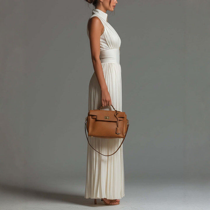 Fashionable women's sleeveless mock neck pleated wide leg jumpsuit, an elegant choice for any wardrobe.