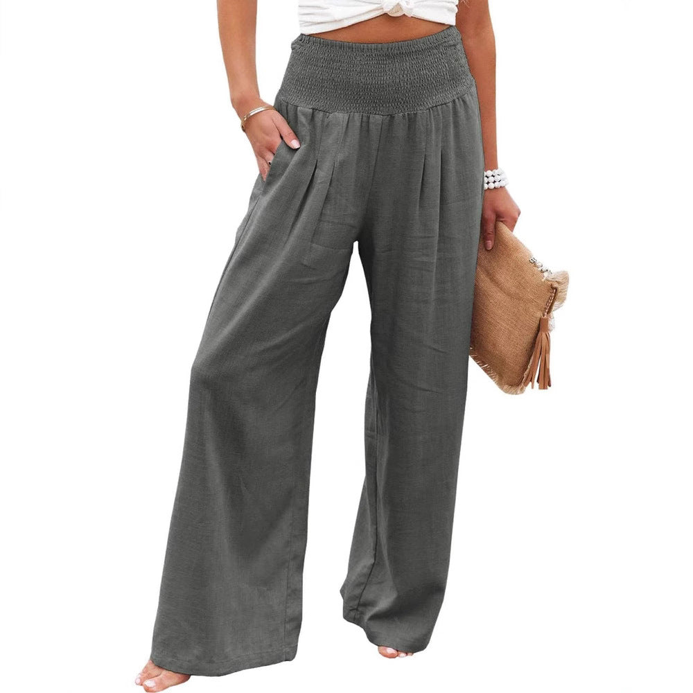 Versatile women's linen trousers, wide leg, pleated, and comfortable elastic waist.