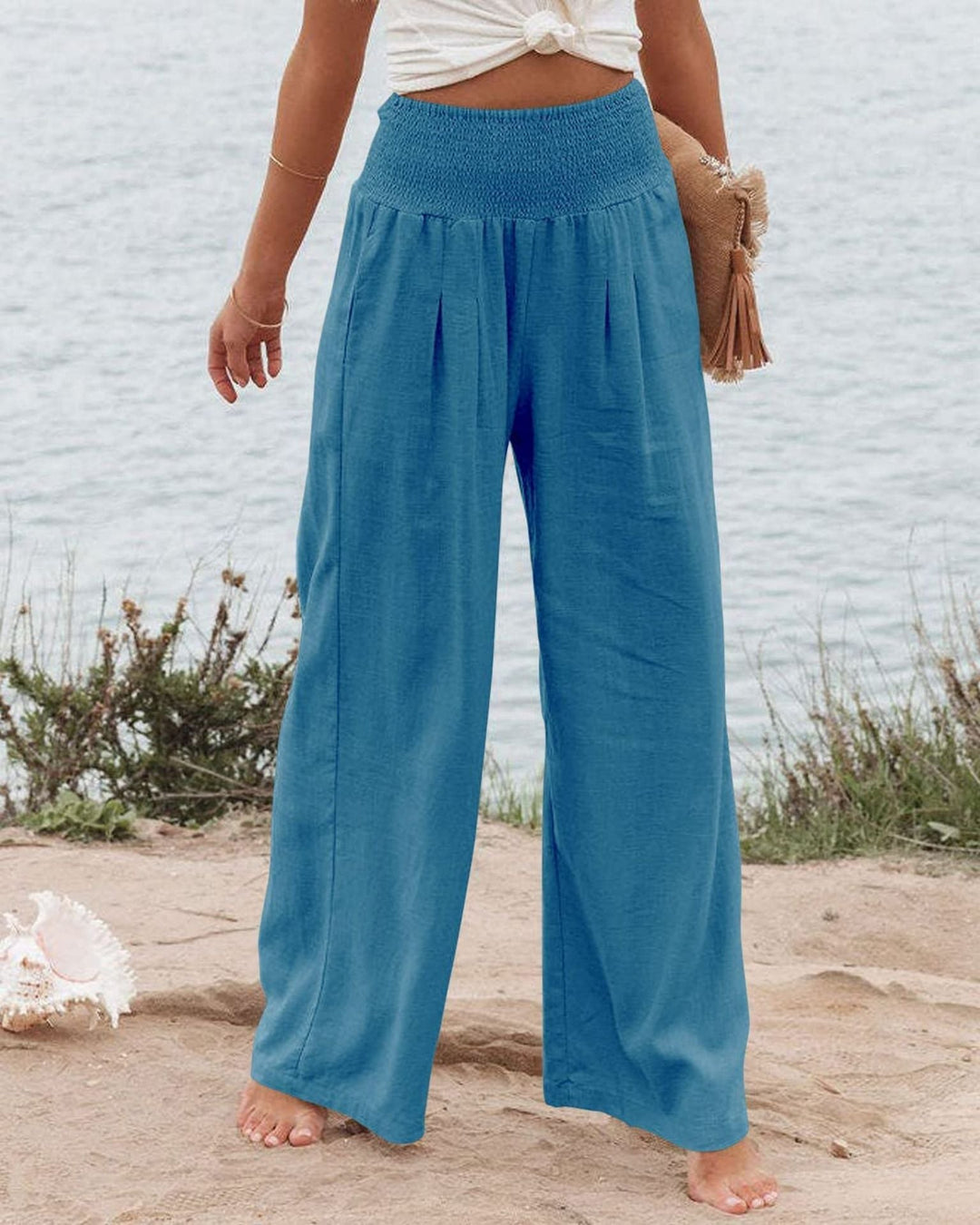 Casual women's linen blend wide leg pants with a trendy pleated design.