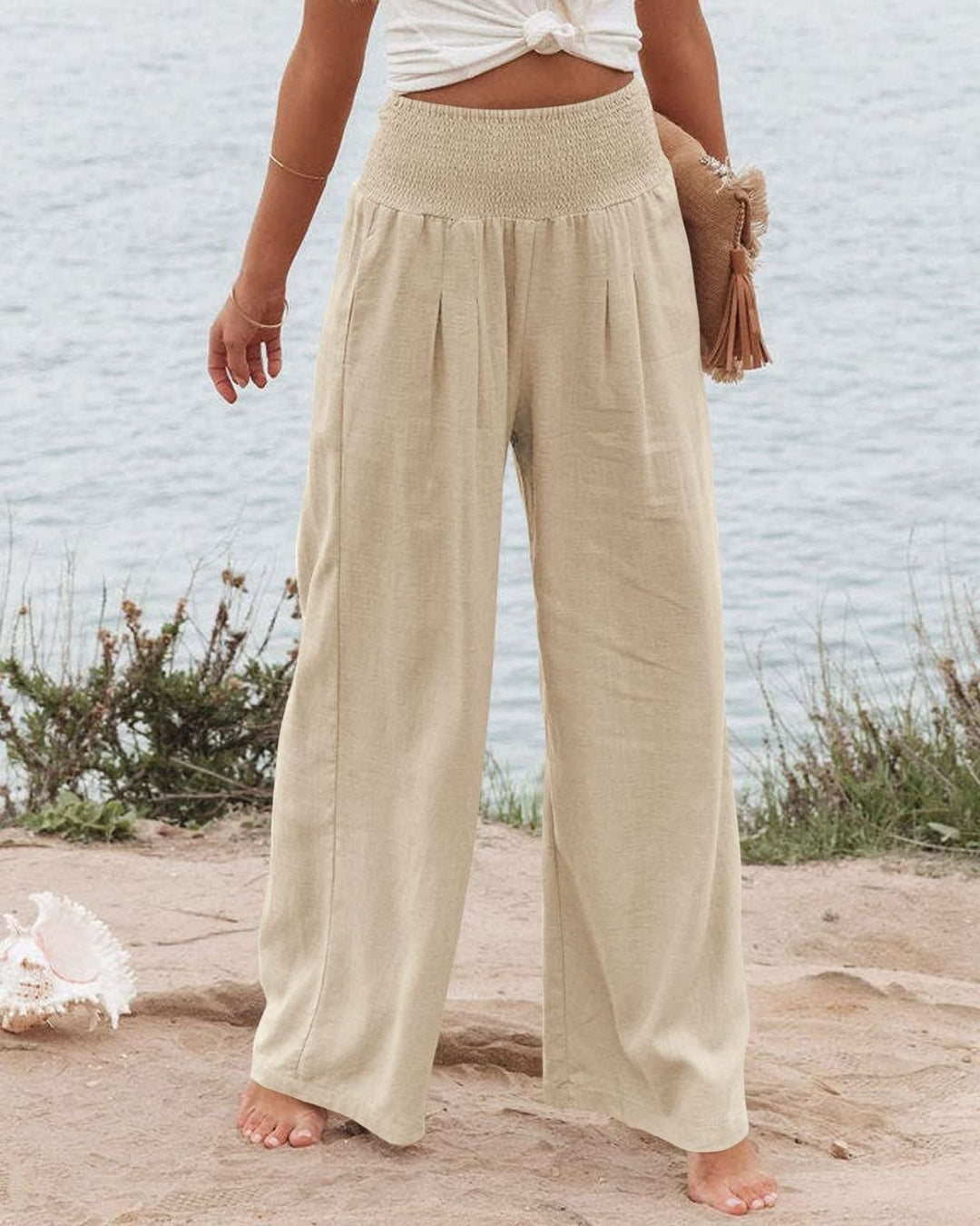 Summer fashion: Women's wide leg pleated trousers with elastic waist for comfort.
