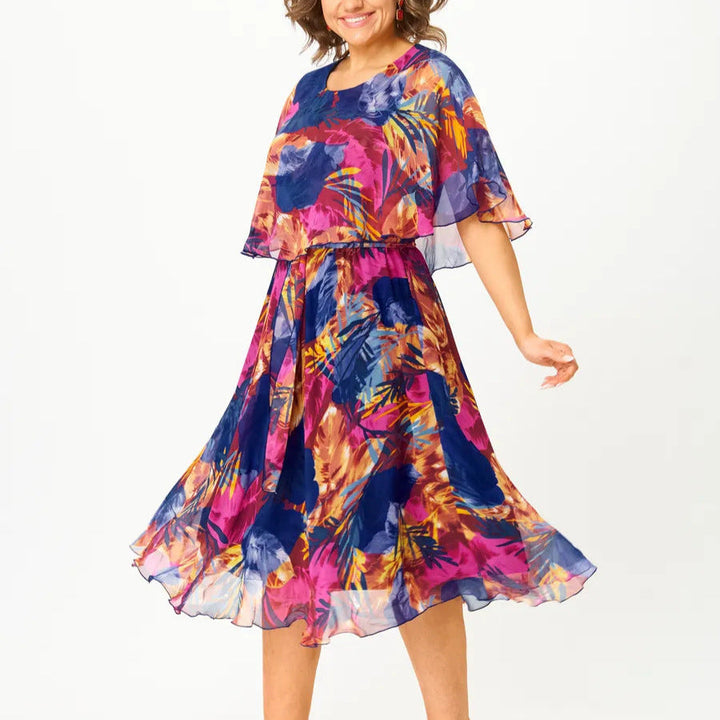 Comfortable plus size women's flowy midi dress, an A-line cut in a vibrant summer print for any occasion.