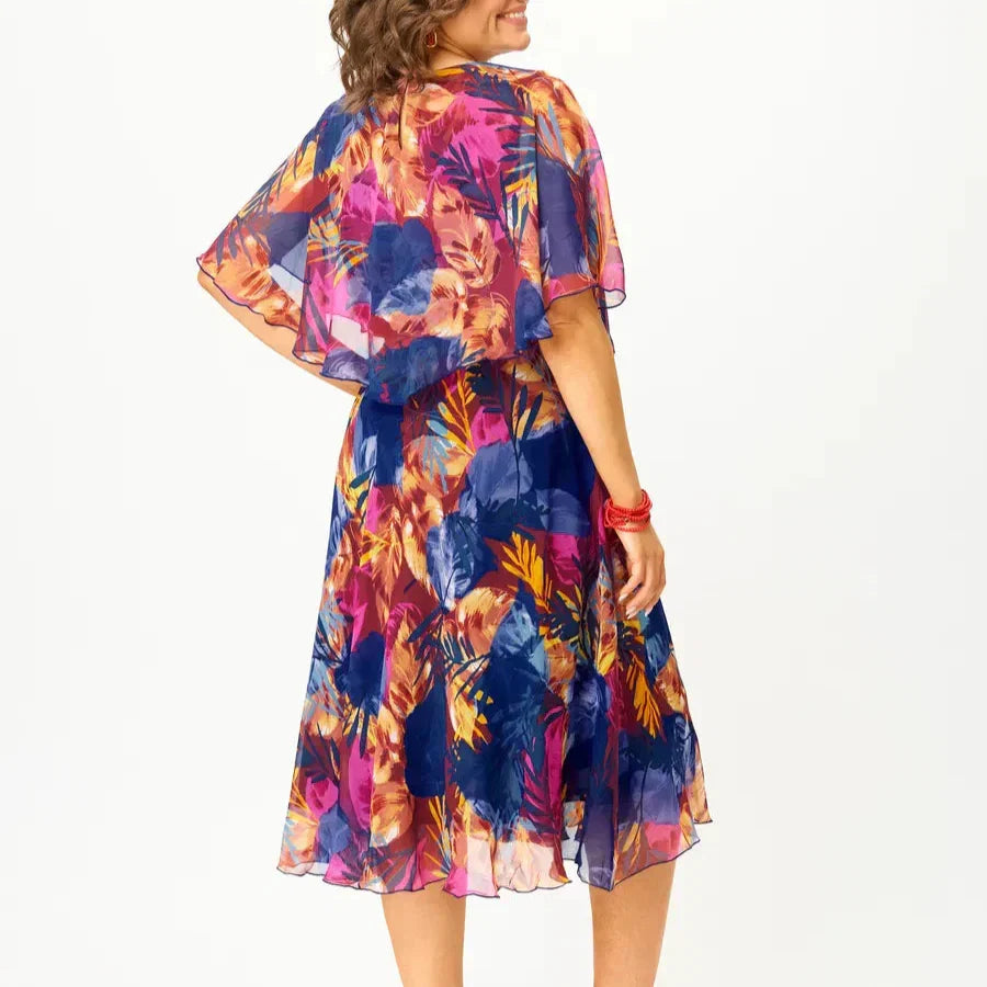 Vibrant print plus size flowy summer dress, a comfortable A-line midi perfect for elegant casual or vacation wear.