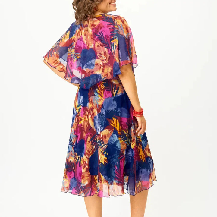Vibrant print plus size flowy summer dress, a comfortable A-line midi perfect for elegant casual or vacation wear.