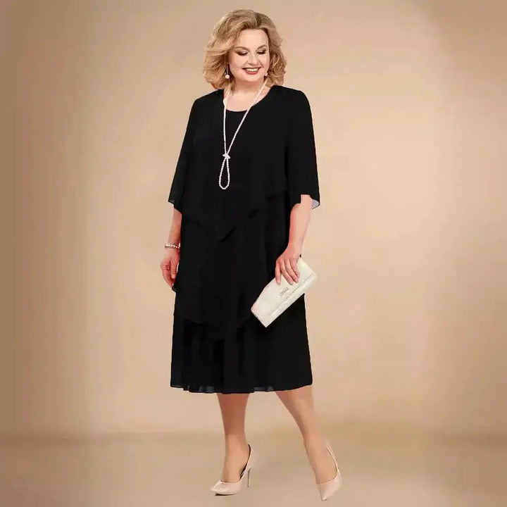 Women's plus size layered asymmetrical midi dress for elegant formal wear. Perfect wedding guest or evening dress.