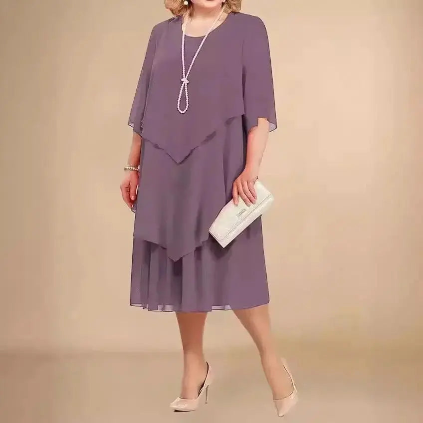 Elegant women's plus size midi dress with flowing layered asymmetrical design. Ideal for special occasions.