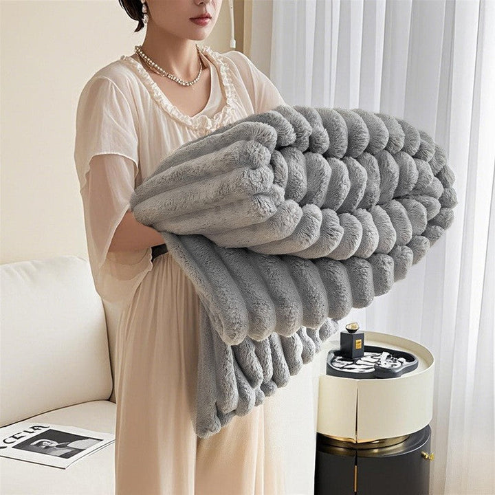 Vibrant women's 3D textured plush blanket, a soft and cozy throw that brings warmth to any home space.