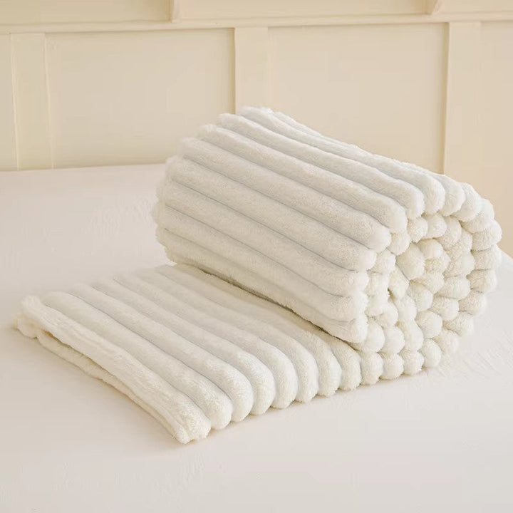 Luxurious women's plush blanket with unique 3D texture, perfect soft throw for home decor.