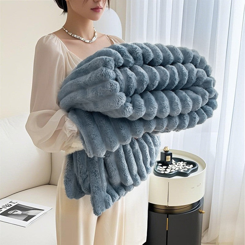 Close-up of a women's plush 3D textured blanket, showcasing its incredibly soft and cozy fabric.