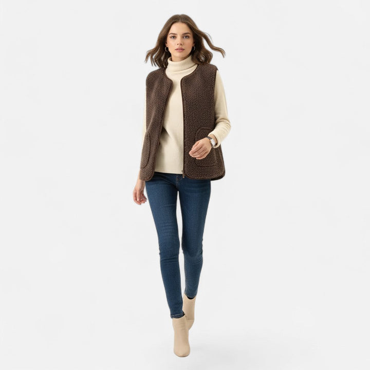 Model wearing a chic, plush cashmere-blend vest for a casual look.