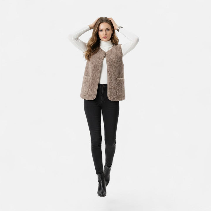 Plush cashmere-blend vest in charcoal grey, showcasing elegant knitwear.