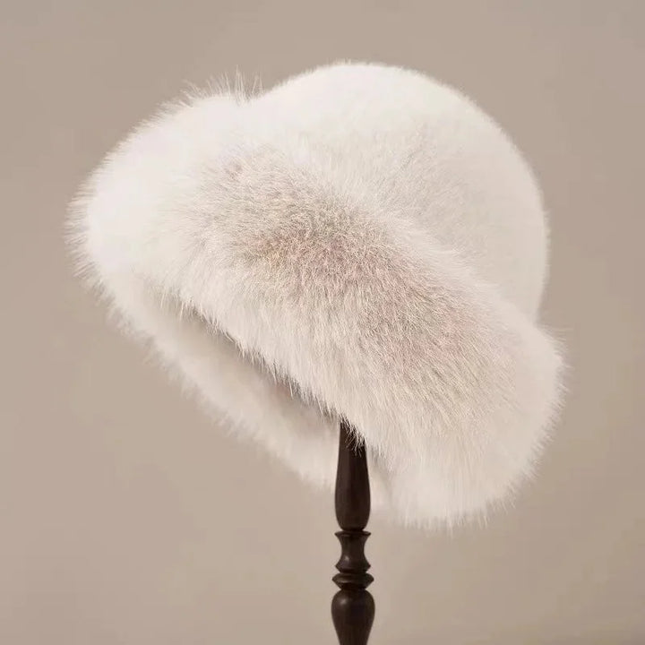 Elegant women's faux fur winter hat, fluffy & soft with a stylish wide cuffed brim. A chic fashion accessory.
