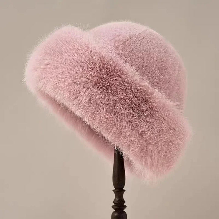 Cozy women's faux fur winter hat with a wide cuffed brim, providing warmth & comfort in cold weather. Plush & soft.
