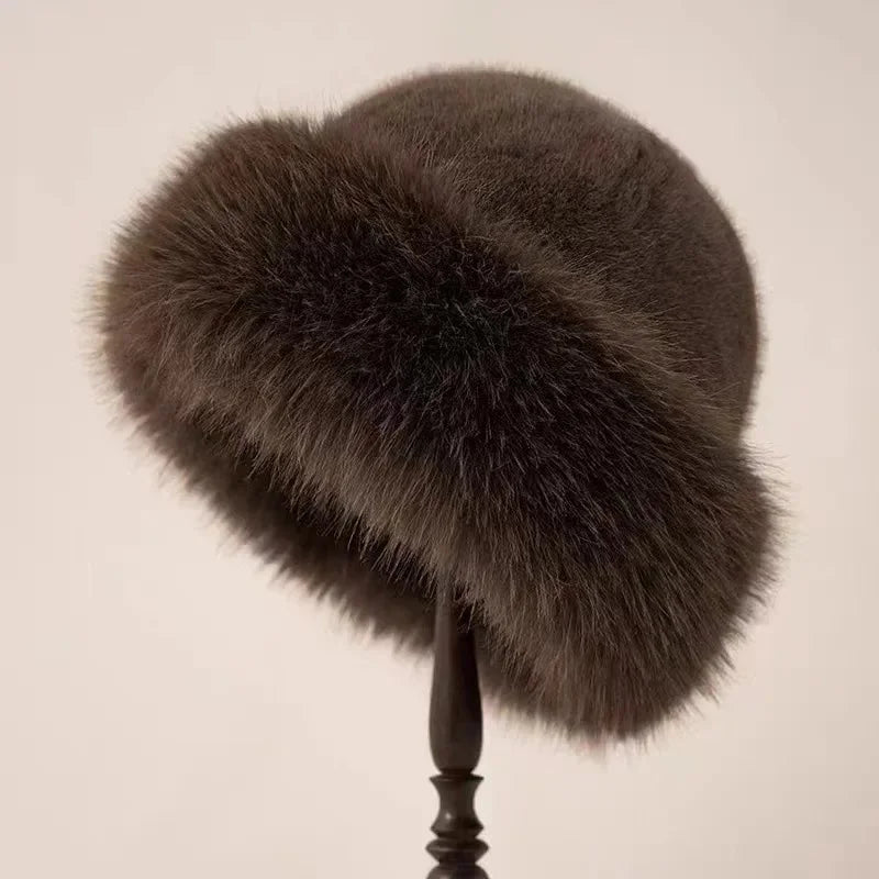 Ladies' fluffy faux fur winter hat featuring a wide cuffed brim. A plush, warm accessory for women in winter.