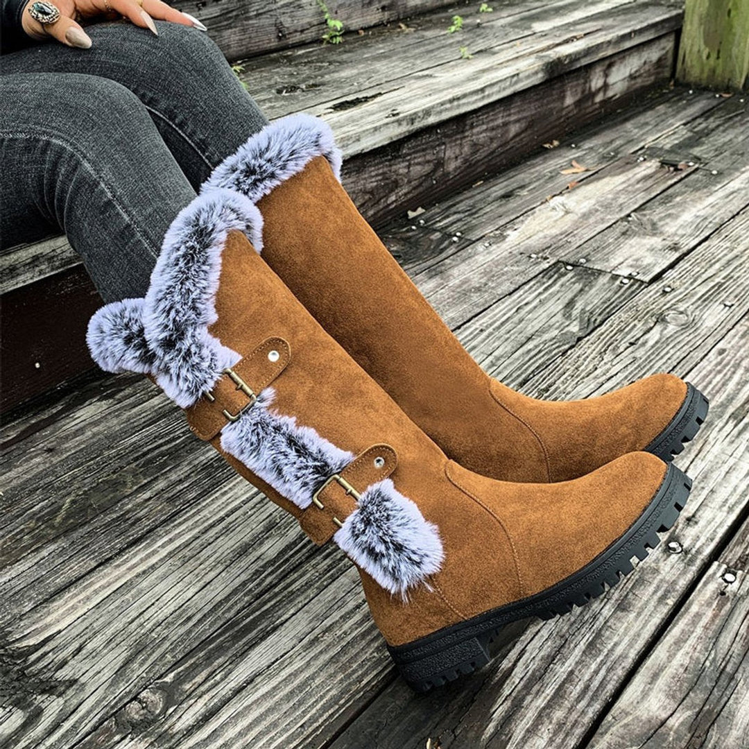 Women's plush-lined knee-high winter boots with buckle details, providing ultimate warmth & comfort.