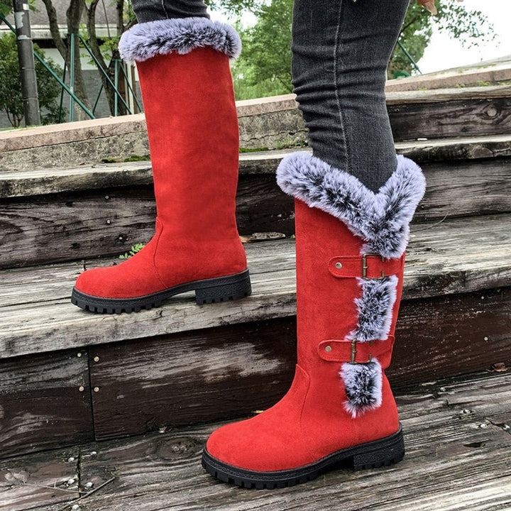 Warm women's knee-high winter boots, plush-lined, featuring stylish buckles & a chunky sole.