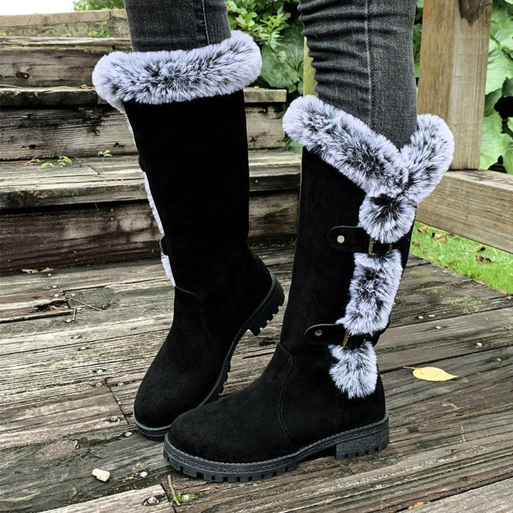 Detailed view of the stylish buckles on women's plush-lined knee-high warm winter boots.
