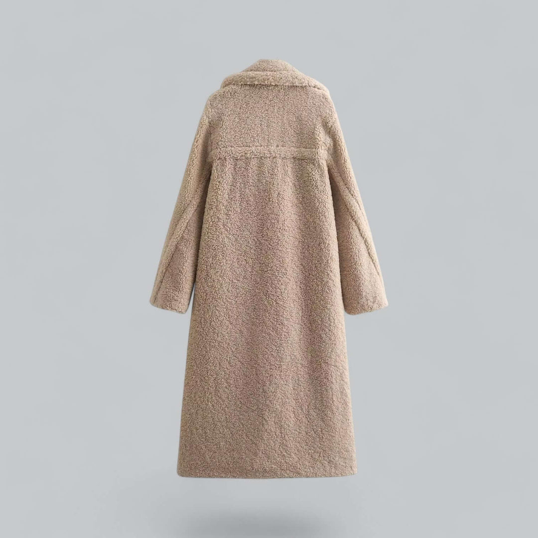 Soft women's teddy long coat, a plush winter jacket offering warmth & elegant fashion. Cozy outerwear.