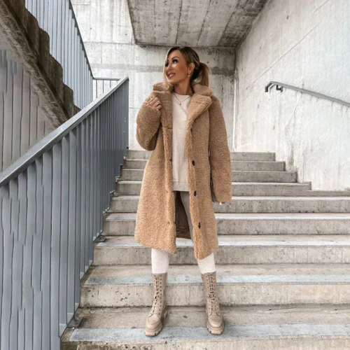 Stay warm in this women's plush button-front winter coat with a classic notched collar.