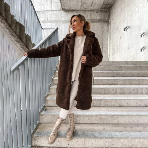 Soft women's plush winter coat, button-front design, notched collar, perfect for cold days.