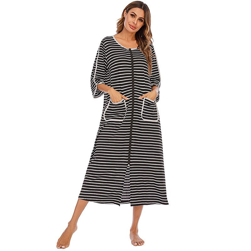 Women's comfort nightdress: plush, hooded, zip-up, mid-length with practical pockets.