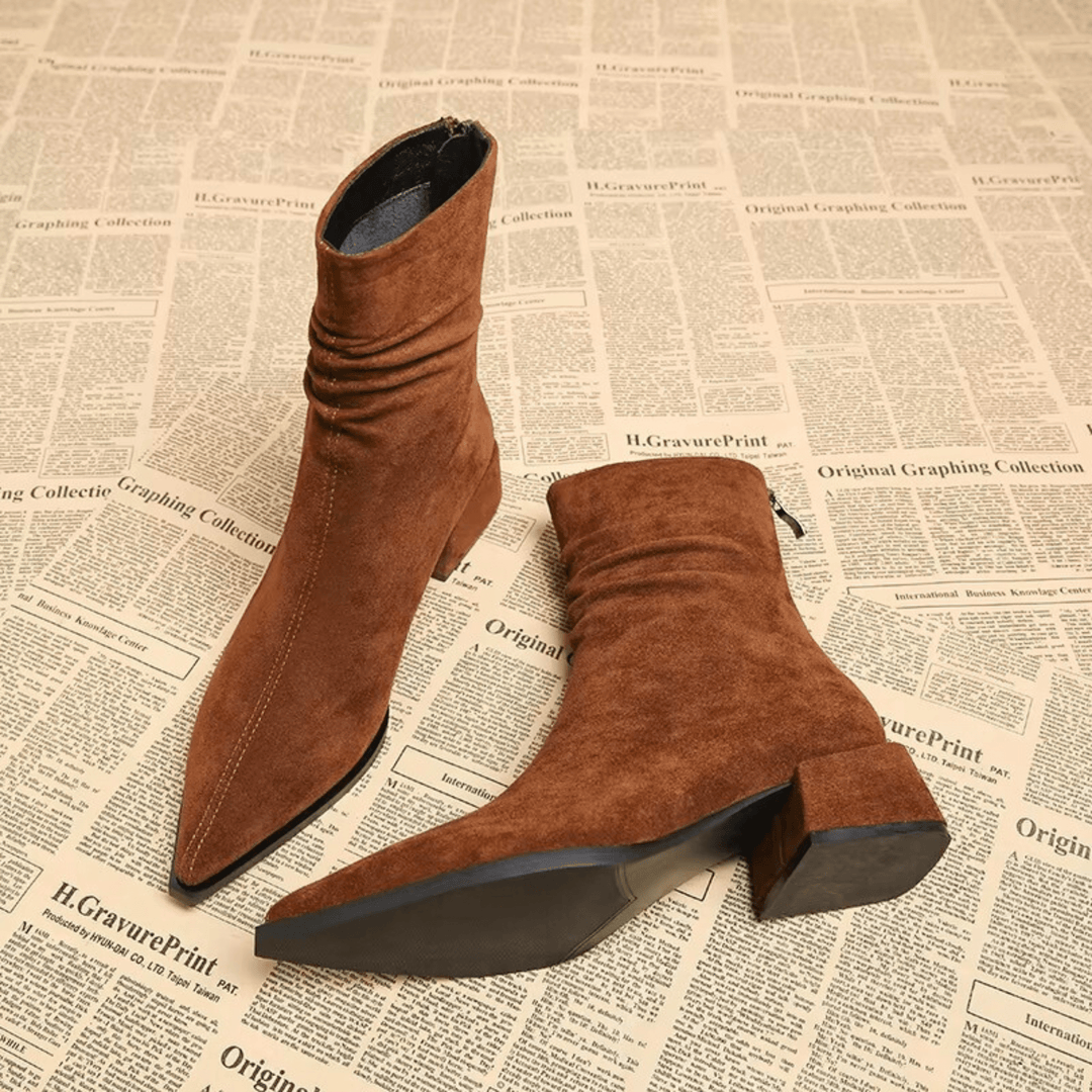 Versatile women's pointed toe ankle boots with a sturdy block heel for chic everyday fashion.