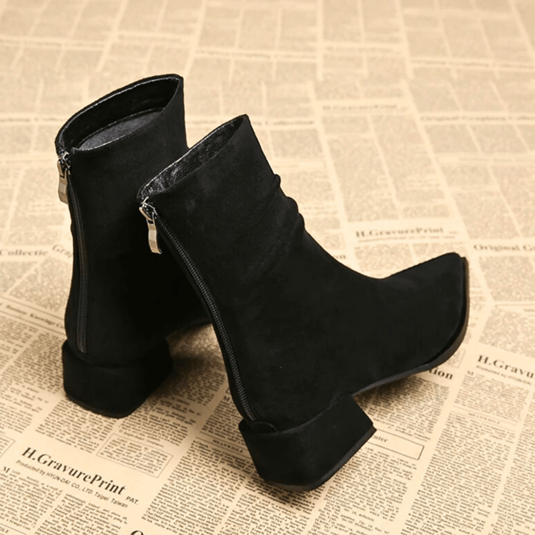 Women's pointed toe ankle boots with a block heel. Essential versatile fashion footwear for any look.