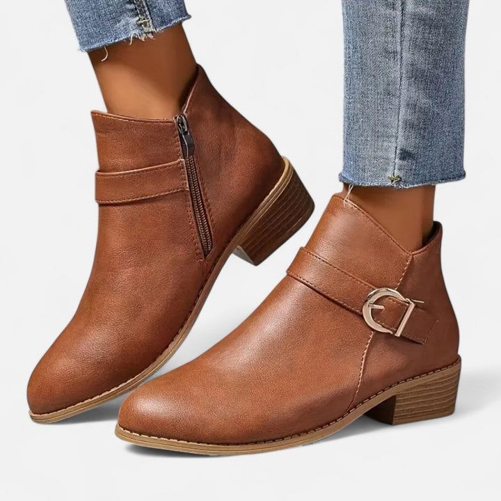 Elegant pointed-toe ankle boots for women, with a fashionable buckle. Chic footwear for diverse outfits.