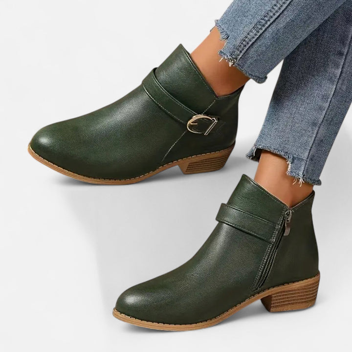 Versatile women's ankle boots: pointed toe, sleek design, and prominent buckle detail. Modern fashion shoes.