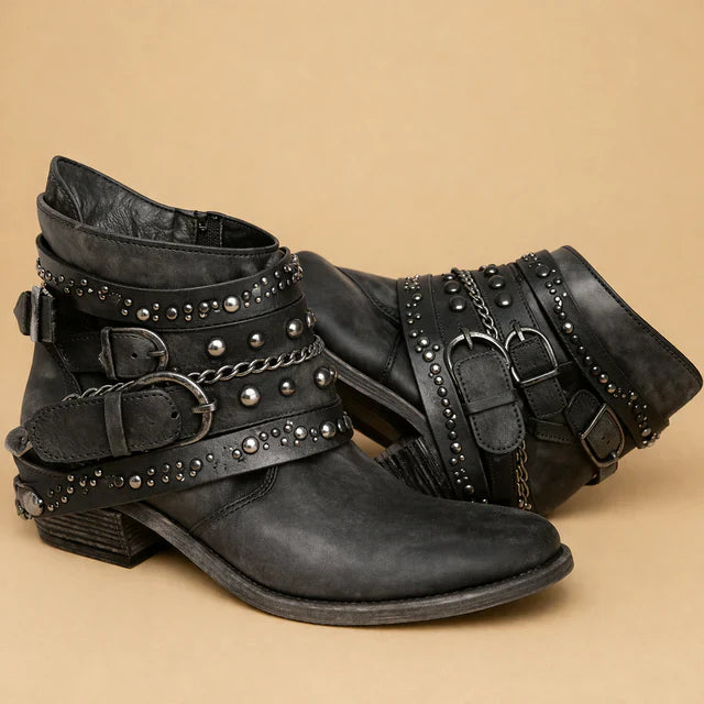 Close-up of intricate stitching on women's fashion western cowboy boots.