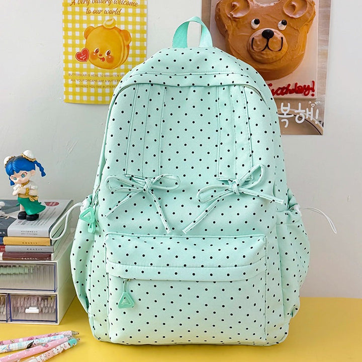 Spacious women's polka dot travel backpack, comfortable and chic for school & daily use.