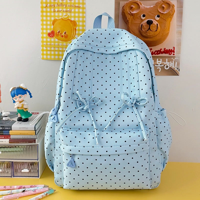 Trendy women's polka dot school bag, a versatile casual backpack for students & travelers.
