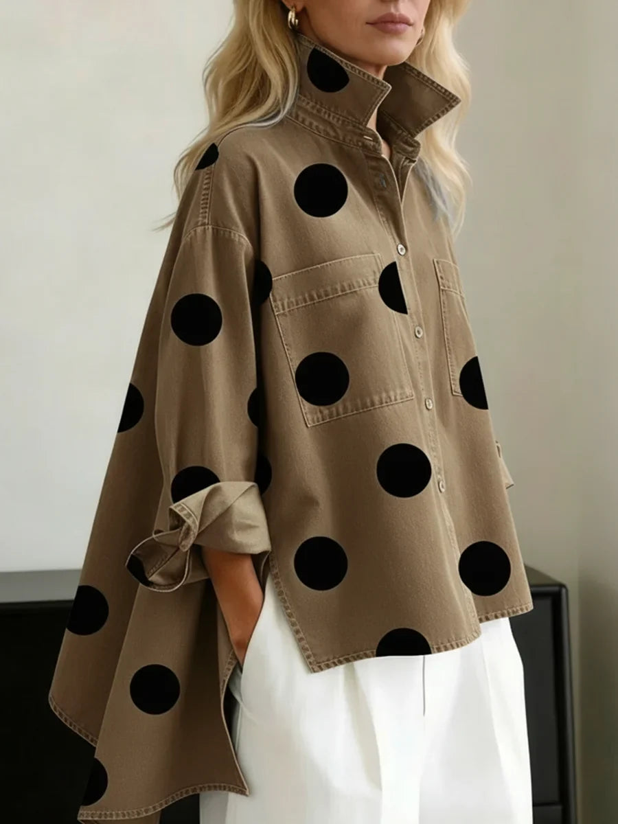 Versatile women's polka dot shirt. Oversized, long sleeve, button-front, and high-low design. Great casual top.