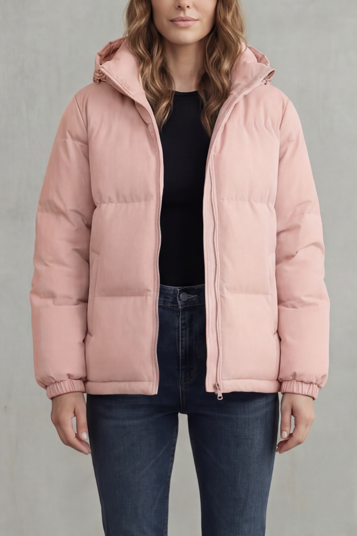 Elegant women's quilted puffer jacket, hooded design. Lightweight yet warm, stylish winter outerwear.