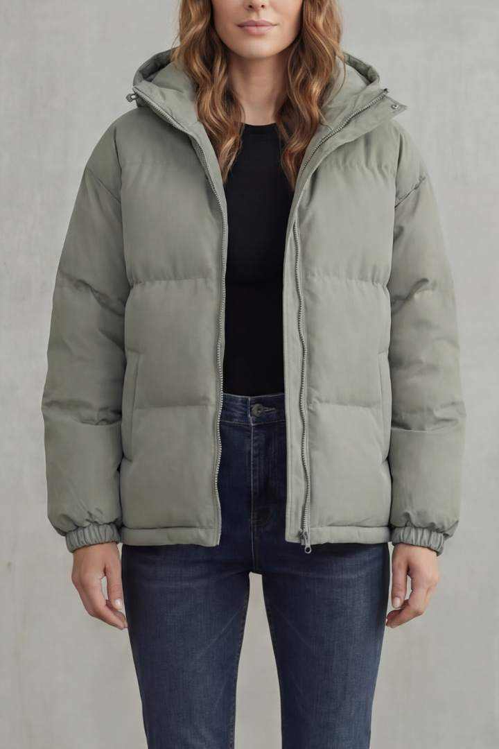 Stay warm in this lightweight women's hooded puffer jacket. Quilted design, perfect casual winter coat.
