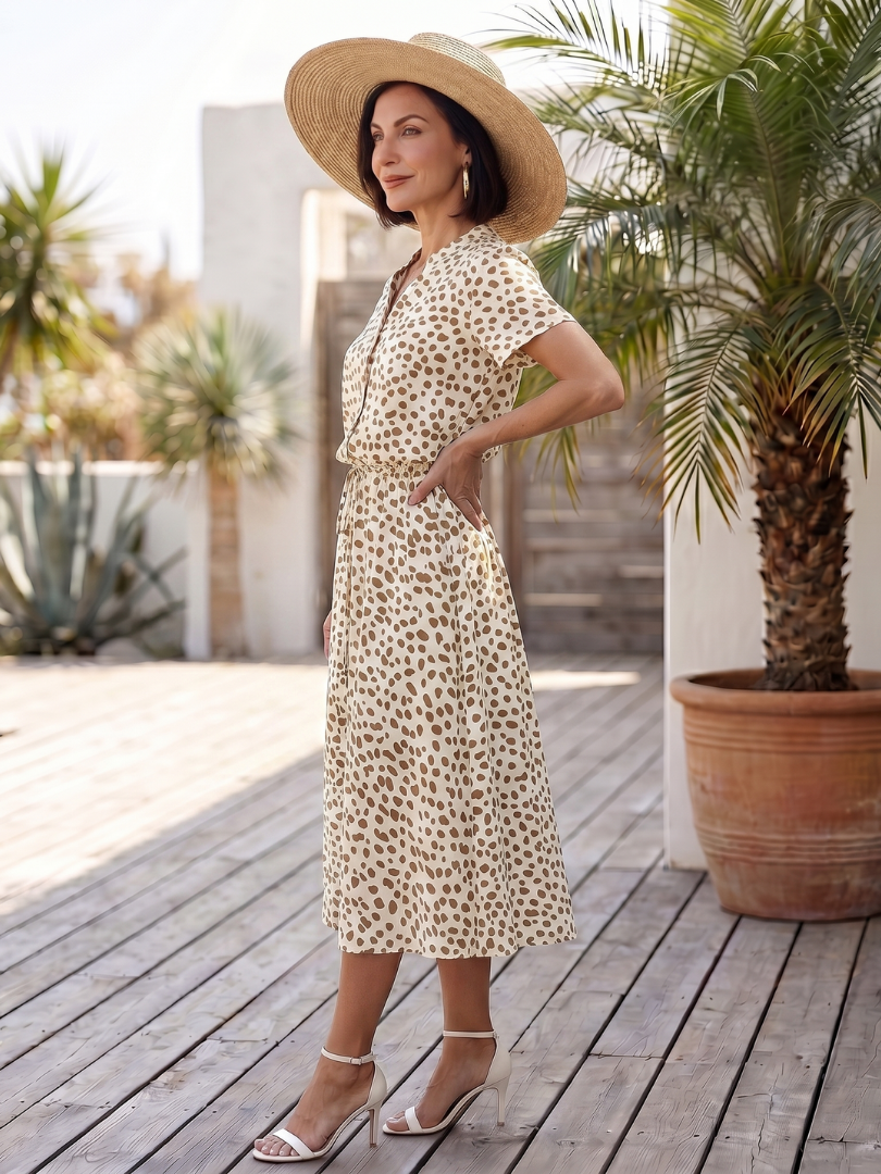 Stylish women's midi dress with unique print. Short sleeve, button front, belted, versatile.