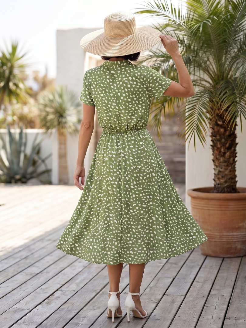 White printed button front short sleeve midi dress. Belted for women's summer style.