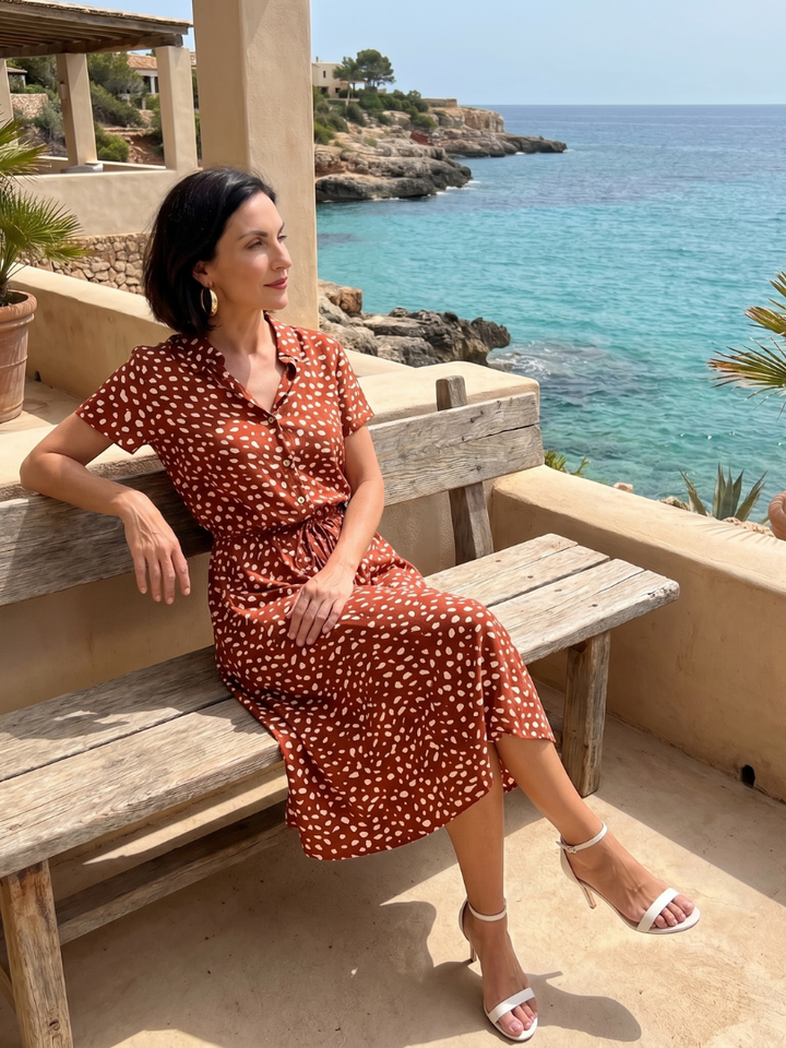 Casual women's printed midi dress. Short sleeve, button front, belted, comfortable relaxed fit.
