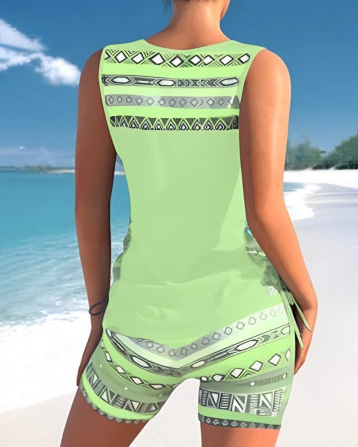 Ladies' holiday swimwear: printed tankini swimsuit with a trendy criss cross neck.